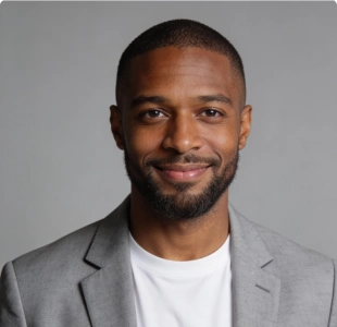 Professional headshot of a man with a beard in a white shirt
