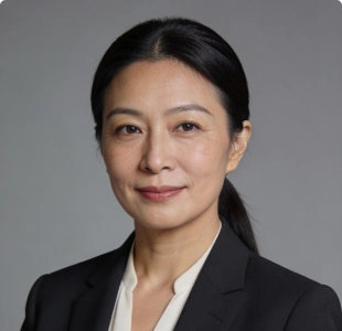 Professional headshot of a woman with dark hair in a dark blazer